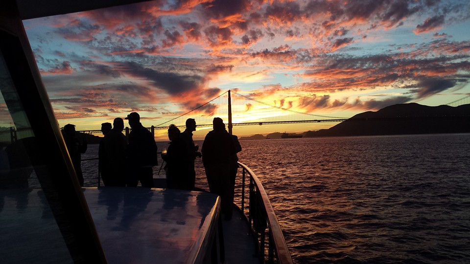 Silhouette sunset, people on deck, Golden Gate